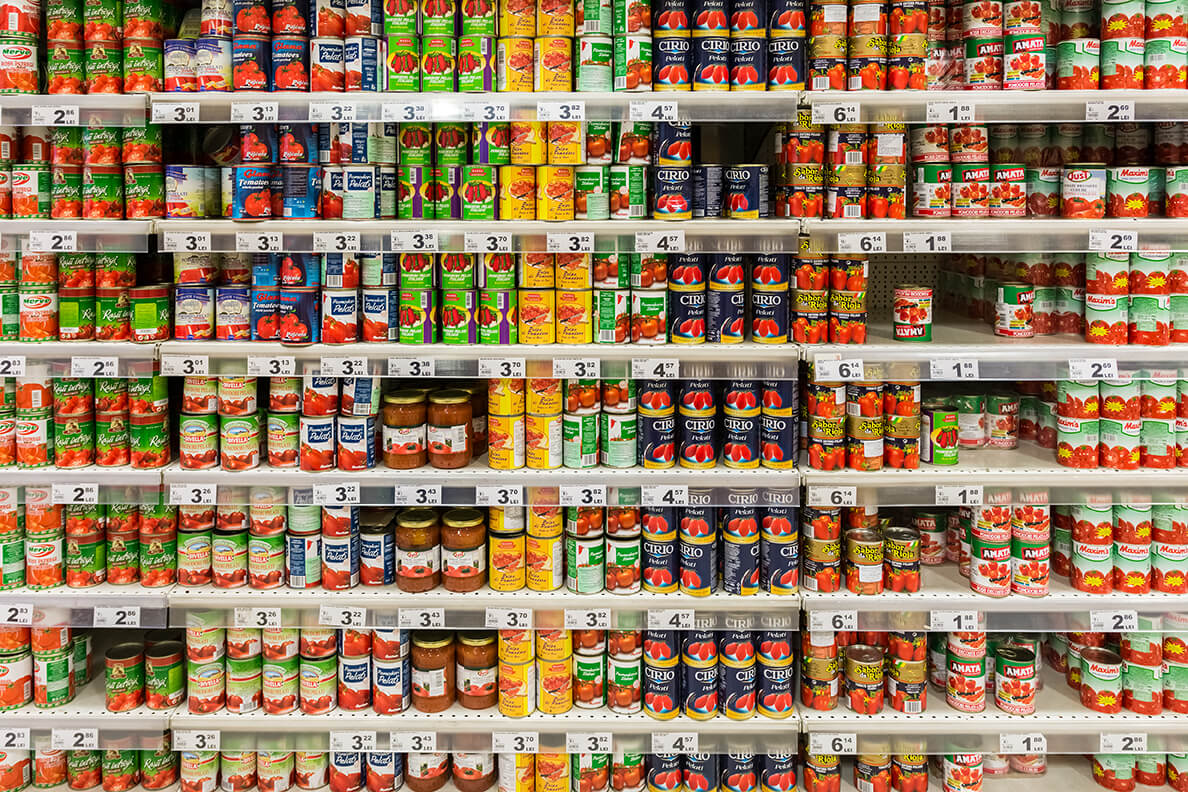 shelf of canned food in a supermarket